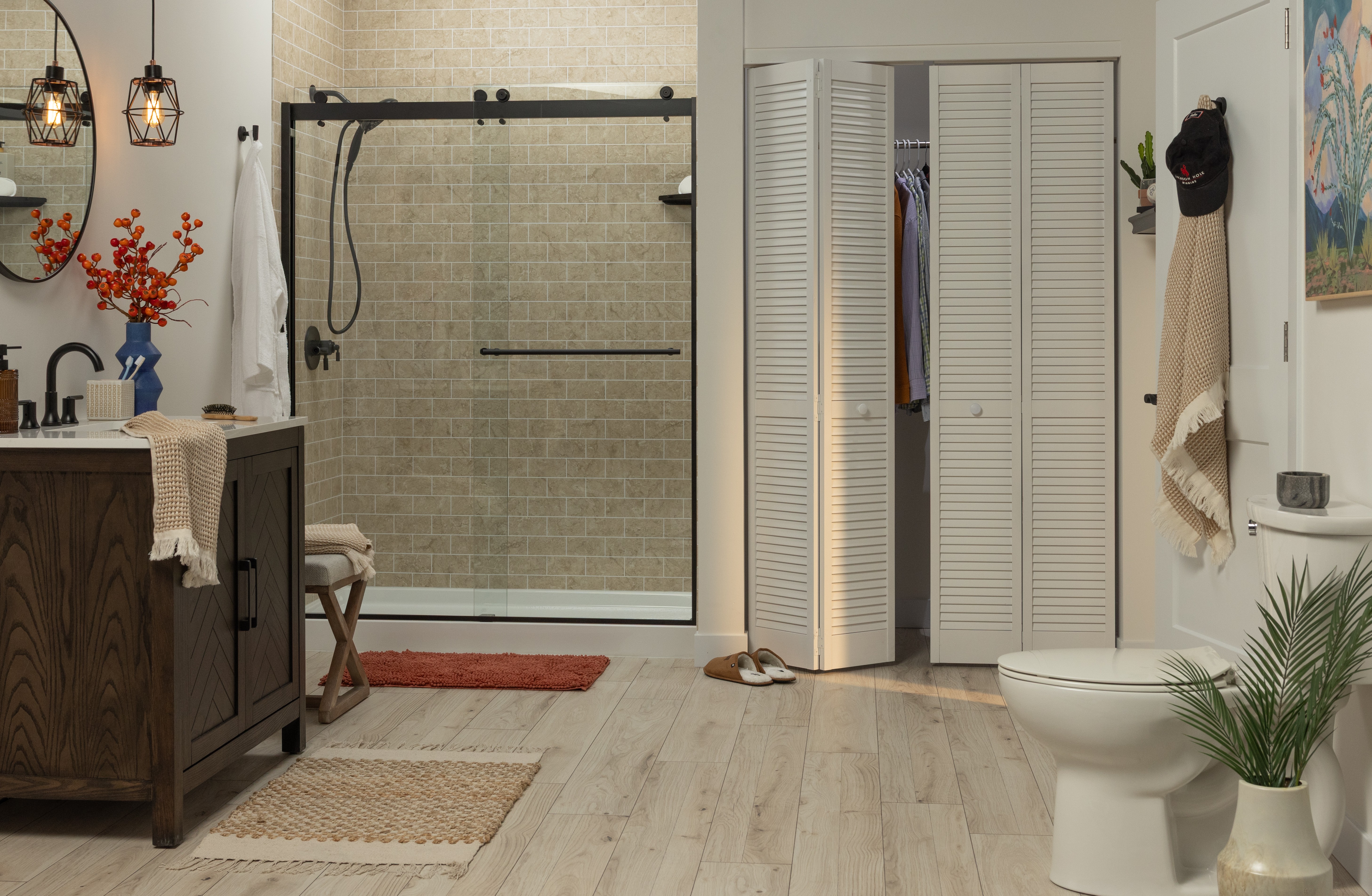 Light wood vanity with glass bifold shower doors — bath liner project